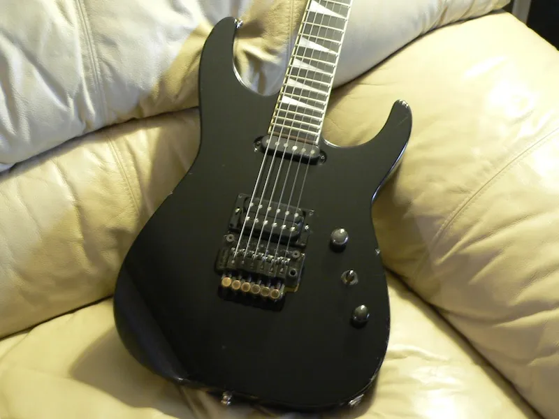 Potato quality photo of a Jackson Soloist guitar